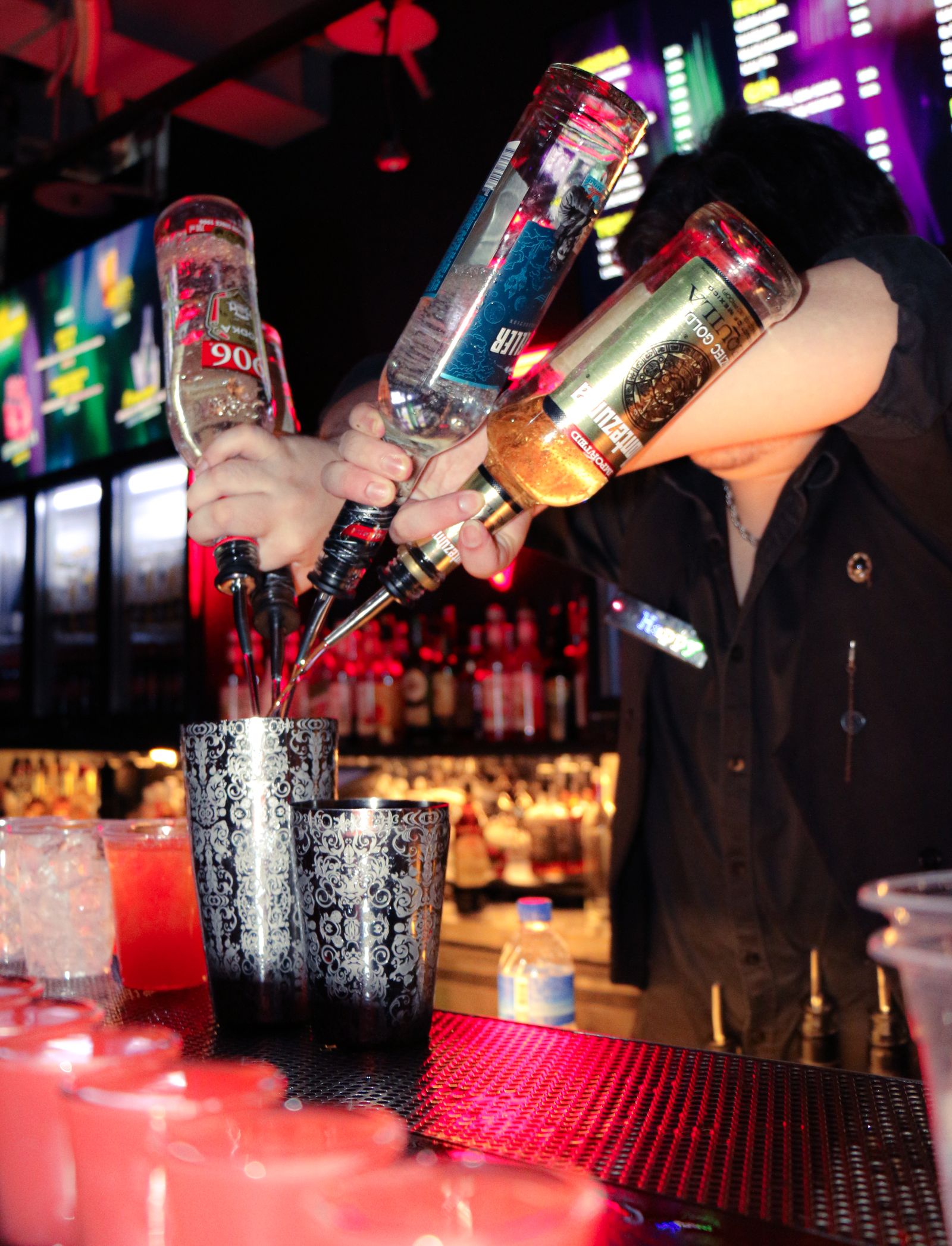 Bartender triple-pour cocktails at Triangle Taipei